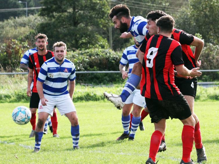 Ned Davies the Tenby number 4 bags the first goal in their 4-1 defeat over Kilgetty. Picture Susan McKehon
